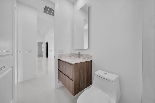 1427 NW 17th St, Cape Coral, FL 33993 - bathroom with toilet, visible vents, and vanity
