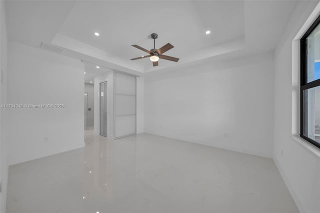 1427 NW 17th St, Cape Coral, FL 33993 - spare room featuring recessed lighting, ceiling fan, visible vents, and a raised ceiling