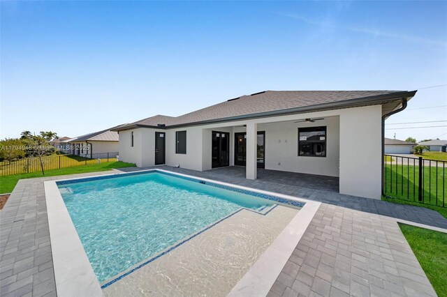 1427 NW 17th St, Cape Coral, FL 33993 - view of pool with a fenced in pool, a patio area, fence, and a lawn