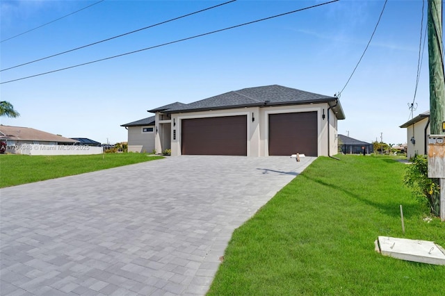 1427 NW 17th St, Cape Coral, FL 33993 - prairie-style home with decorative driveway, an attached garage, a front yard, and stucco siding