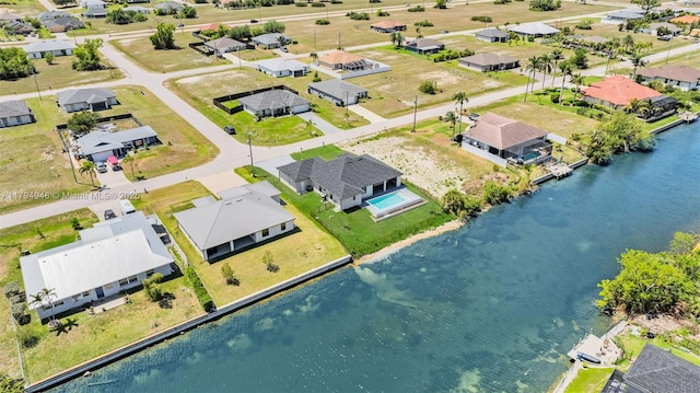 1427 NW 17th St, Cape Coral, FL 33993 - aerial view with a water view and a residential view