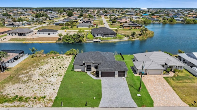 1427 NW 17th St, Cape Coral, FL 33993 - birds eye view of property featuring a water view and a residential view