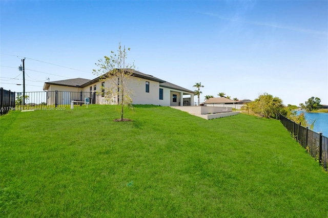 1427 NW 17th St, Cape Coral, FL 33993 - rear view of property with a yard, a patio, a fenced backyard, and stucco siding