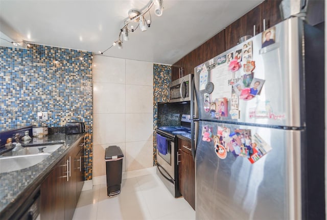 800 N Miami Ave Unit E-809, Miami, FL 33136 - kitchen featuring a sink, appliances with stainless steel finishes, light tile patterned floors, and dark brown cabinets