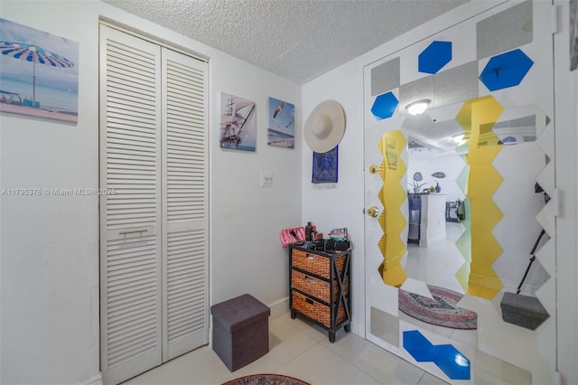 800 N Miami Ave Unit E-809, Miami, FL 33136 - hallway with tile patterned flooring and a textured ceiling