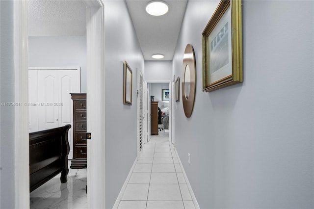 hallway featuring baseboards
