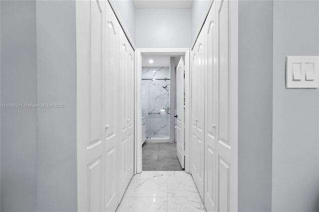 hallway with marble finish floor