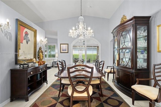 dining room with a wealth of natural light, a chandelier, lofted ceiling, and arched walkways