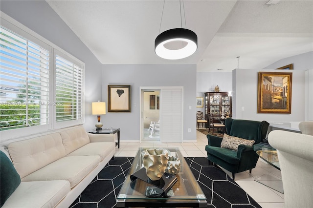 living area with a wealth of natural light and light tile patterned floors