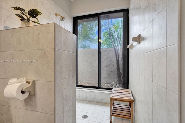bathroom with a tile shower
