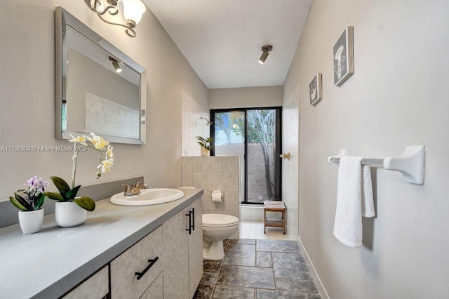 bathroom featuring vanity and toilet