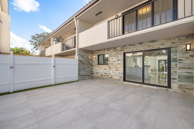 view of patio featuring fence
