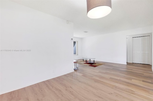 empty room featuring wood finished floors