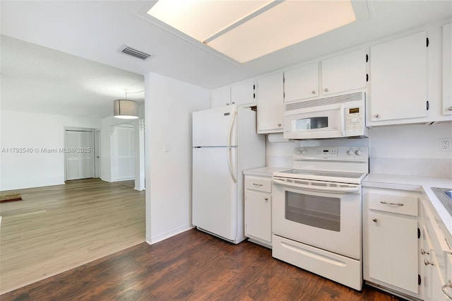 kitchen featuring visible vents, white appliances, dark wood-type flooring, light countertops, and white cabinets
