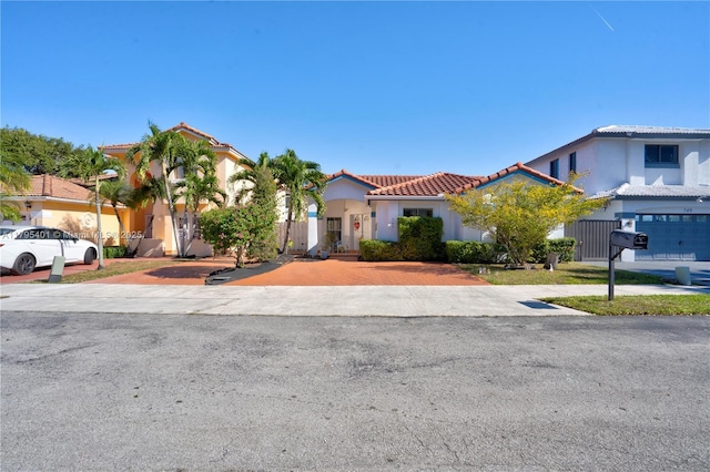 767 NW 122nd Pl, Miami, FL 33182 - mediterranean / spanish home featuring stucco siding, decorative driveway, and a tile roof