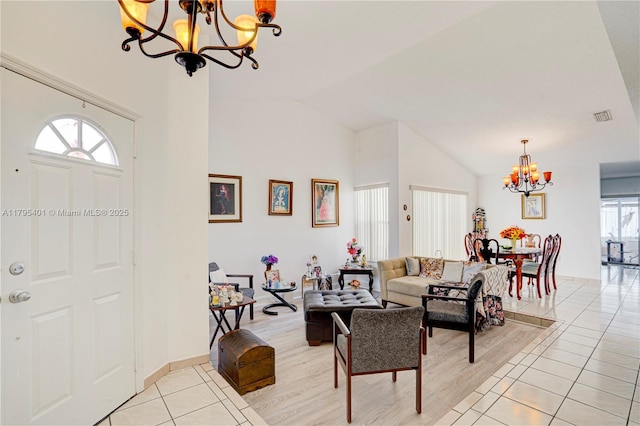 767 NW 122nd Pl, Miami, FL 33182 - living room featuring high vaulted ceiling, visible vents, light tile patterned flooring, and a chandelier