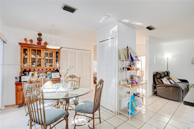 767 NW 122nd Pl, Miami, FL 33182 - dining room featuring visible vents, baseboards, and light tile patterned floors