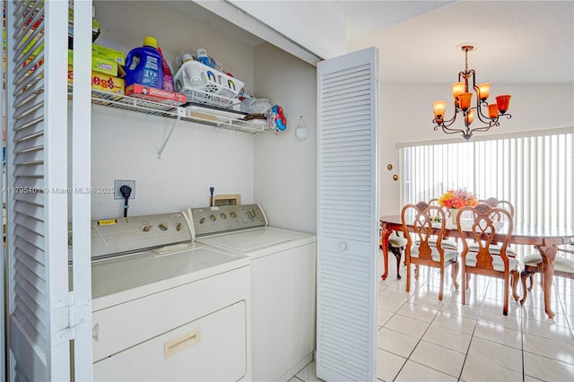 767 NW 122nd Pl, Miami, FL 33182 - washroom featuring independent washer and dryer, laundry area, a notable chandelier, and light tile patterned floors
