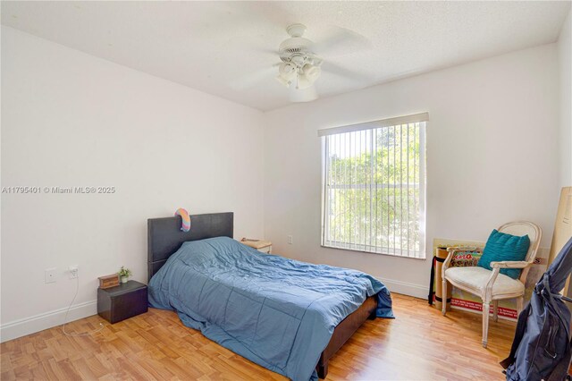 767 NW 122nd Pl, Miami, FL 33182 - bedroom featuring baseboards, a ceiling fan, and wood finished floors