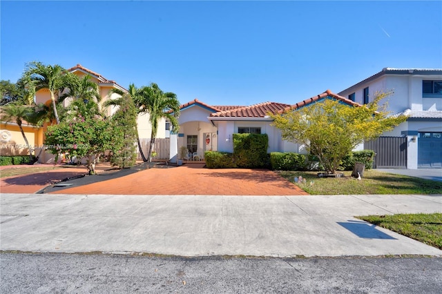 767 NW 122nd Pl, Miami, FL 33182 - mediterranean / spanish-style home with fence, a tiled roof, and stucco siding