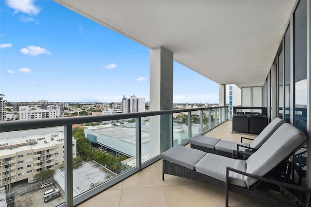 balcony with a view of city and outdoor lounge area