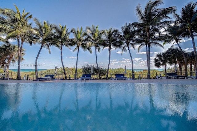 view of pool featuring a water view
