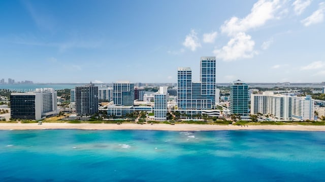 bird's eye view with a beach view, a water view, and a city view