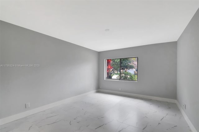 8055 Sweetbriar Way, Boca Raton, FL 33496 - spare room featuring baseboards and marble finish floor