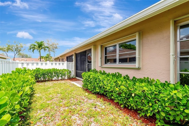 8055 Sweetbriar Way, Boca Raton, FL 33496 - doorway to property featuring stucco siding and fence