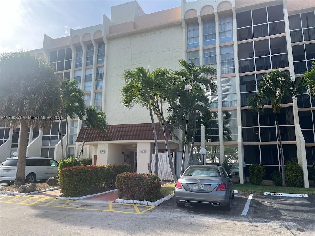 view of property with uncovered parking