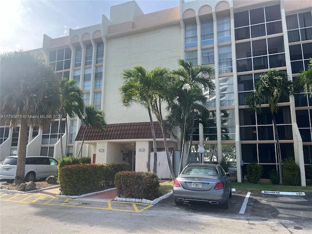 view of property with uncovered parking