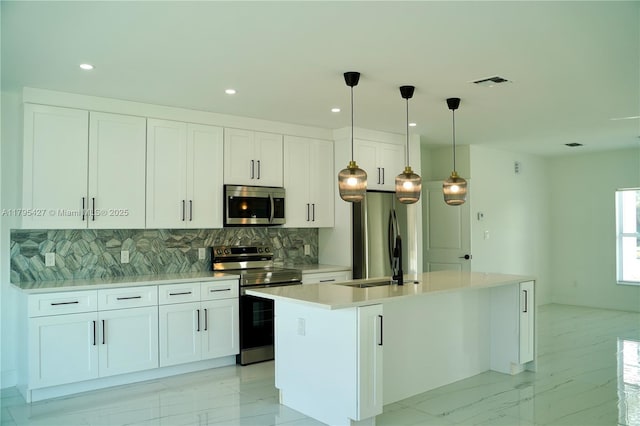 kitchen featuring backsplash, visible vents, appliances with stainless steel finishes, and marble finish floor