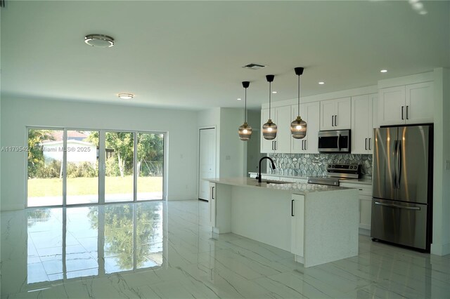 kitchen with appliances with stainless steel finishes, a sink, marble finish floor, tasteful backsplash, and visible vents