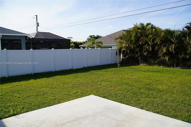 view of yard featuring a patio area and fence