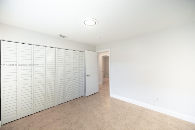 13150 SW 106th St, Miami, FL 33186 - unfurnished bedroom with baseboards, a closet, tile patterned floors, and visible vents