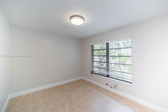 13150 SW 106th St, Miami, FL 33186 - empty room featuring baseboards and light tile patterned flooring