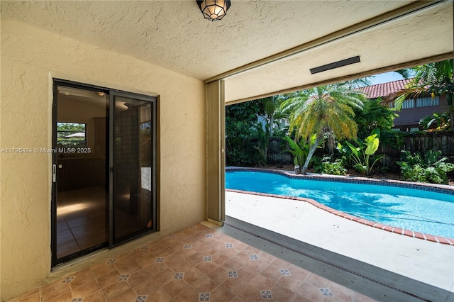 13150 SW 106th St, Miami, FL 33186 - view of swimming pool with a fenced in pool, fence, and a patio