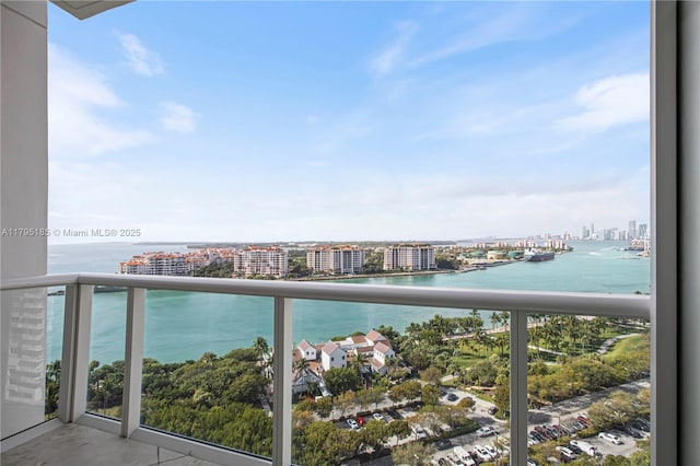 balcony featuring a water view and a view of city