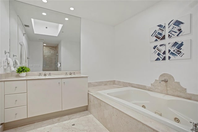 bathroom with vanity, a whirlpool tub, visible vents, and a stall shower