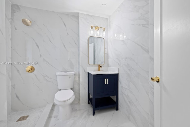 bathroom featuring tile walls, vanity, toilet, marble finish floor, and a marble finish shower