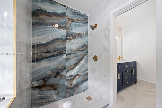 bathroom with a marble finish shower, marble finish floor, and vanity