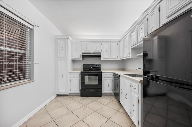 2861 Somerset Dr Unit 104, Lauderdale Lakes, FL 33311 - kitchen featuring a sink, light countertops, light tile patterned floors, black appliances, and under cabinet range hood