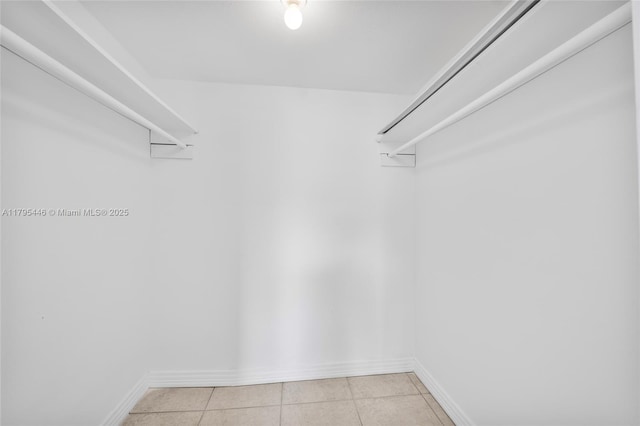 2861 Somerset Dr Unit 104, Lauderdale Lakes, FL 33311 - walk in closet featuring light tile patterned floors