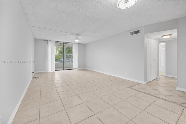 2861 Somerset Dr Unit 104, Lauderdale Lakes, FL 33311 - unfurnished room with a textured ceiling, visible vents, and light tile patterned floors
