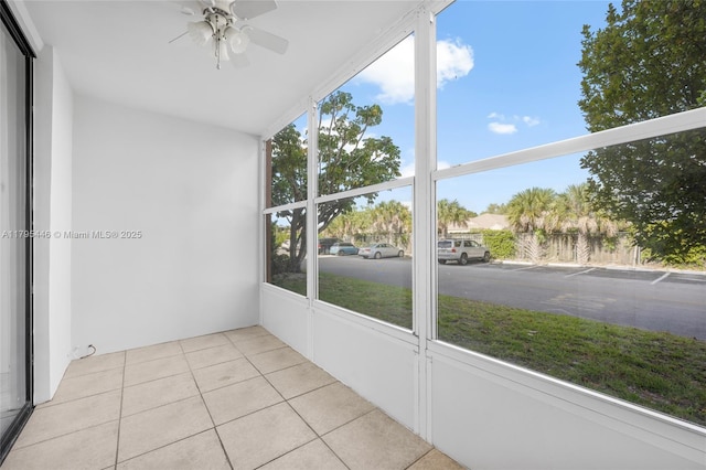 2861 Somerset Dr Unit 104, Lauderdale Lakes, FL 33311 - unfurnished sunroom featuring a ceiling fan and tile patterned floors