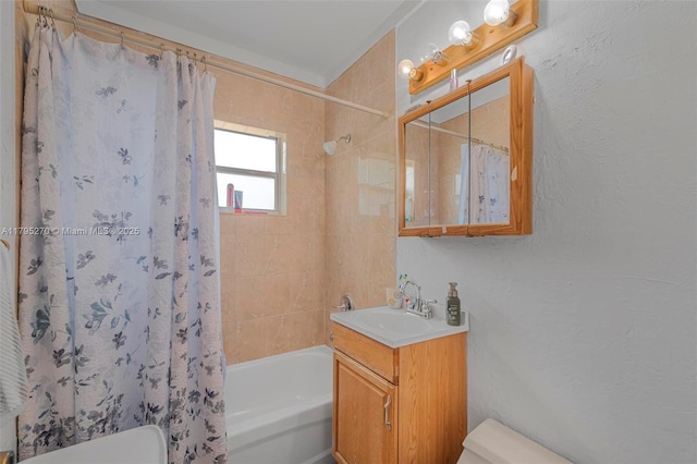 bathroom with vanity, toilet, and shower / tub combo