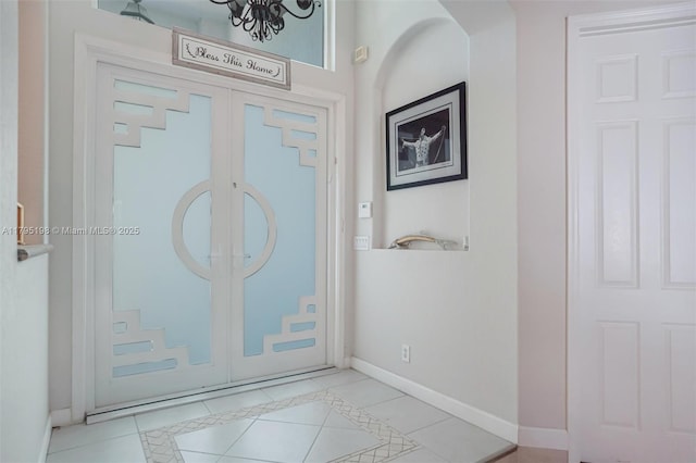 12307 NW 49th St, Coral Springs, FL 33076 - tiled entryway with baseboards and arched walkways