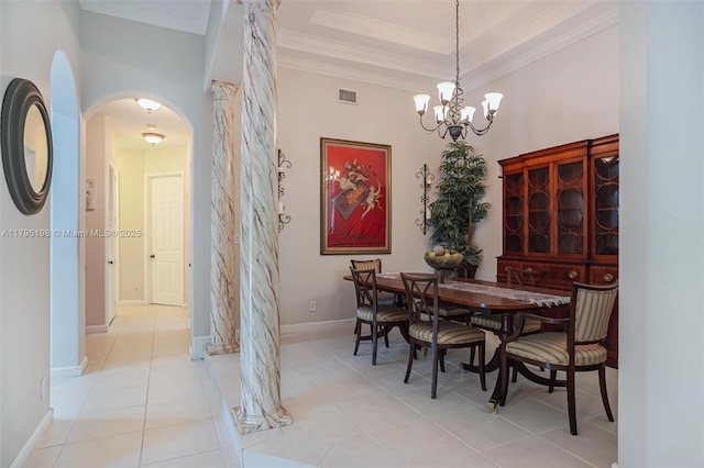 12307 NW 49th St, Coral Springs, FL 33076 - dining space with arched walkways, a chandelier, crown molding, light tile patterned floors, and baseboards