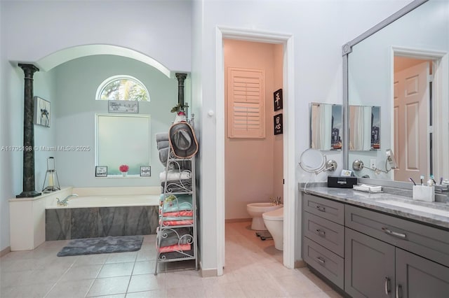 12307 NW 49th St, Coral Springs, FL 33076 - full bath featuring a bidet, a garden tub, vanity, tile patterned floors, and baseboards
