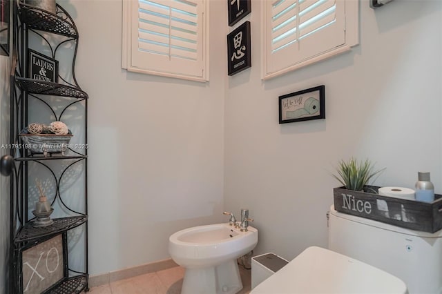 12307 NW 49th St, Coral Springs, FL 33076 - half bathroom with a bidet, toilet, and tile patterned floors